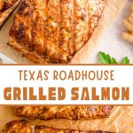 Juicy grilled salmon with a golden crust, garnished with fresh herbs and lemon wedges, rests on a wooden board against a grill.