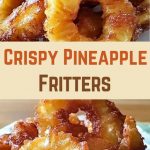 Fluffy golden pineapple pancakes with visible pineapple chunks, stacked and illuminated by soft, warm light.